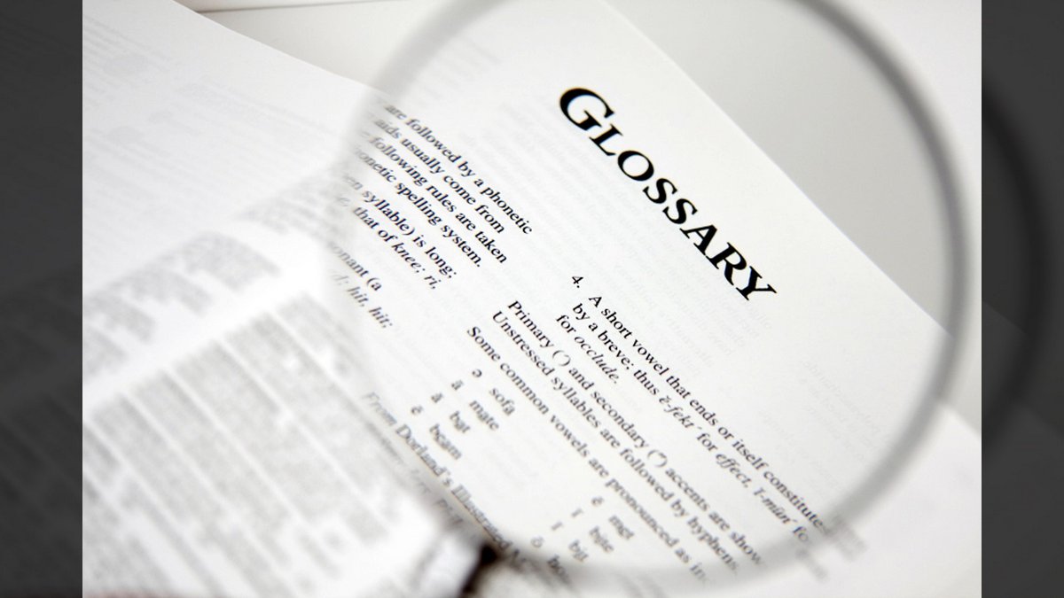DEFINITIONS AND ASSUMPTIONS::MAGNIFIED VIEW OF GLOSSARY LAW IN A BOOK © pick-uppath | iStockPhoto.com
