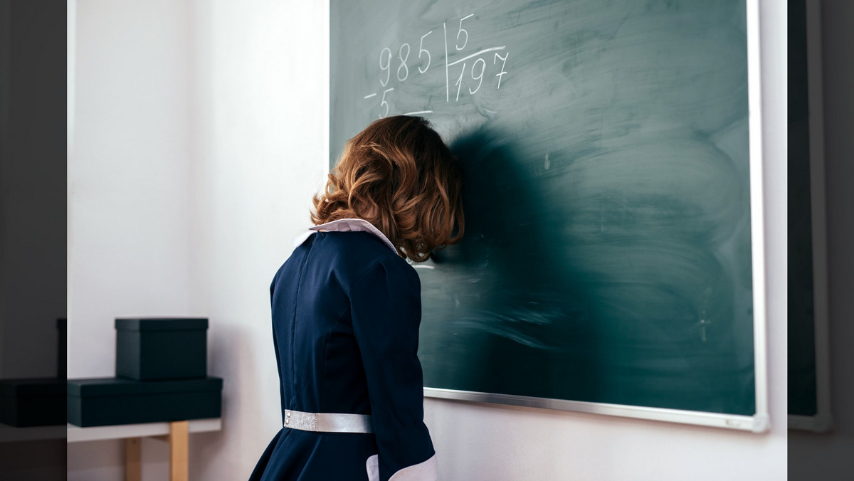 153= I AM G-D?::GIRL WITH HER FOREHEAD ON THE CHALKBOARD © Undrey | Dreamstime.com
