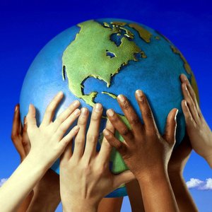 HANDS ON GLOBE © Royalty-Free | Corbis