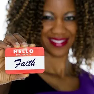 FAITH HAS COME WE ARE NO LONGER UNDER THE LAW::WOMAN HOLDING NAMETAG © RichLegg | iStockPhoto.com