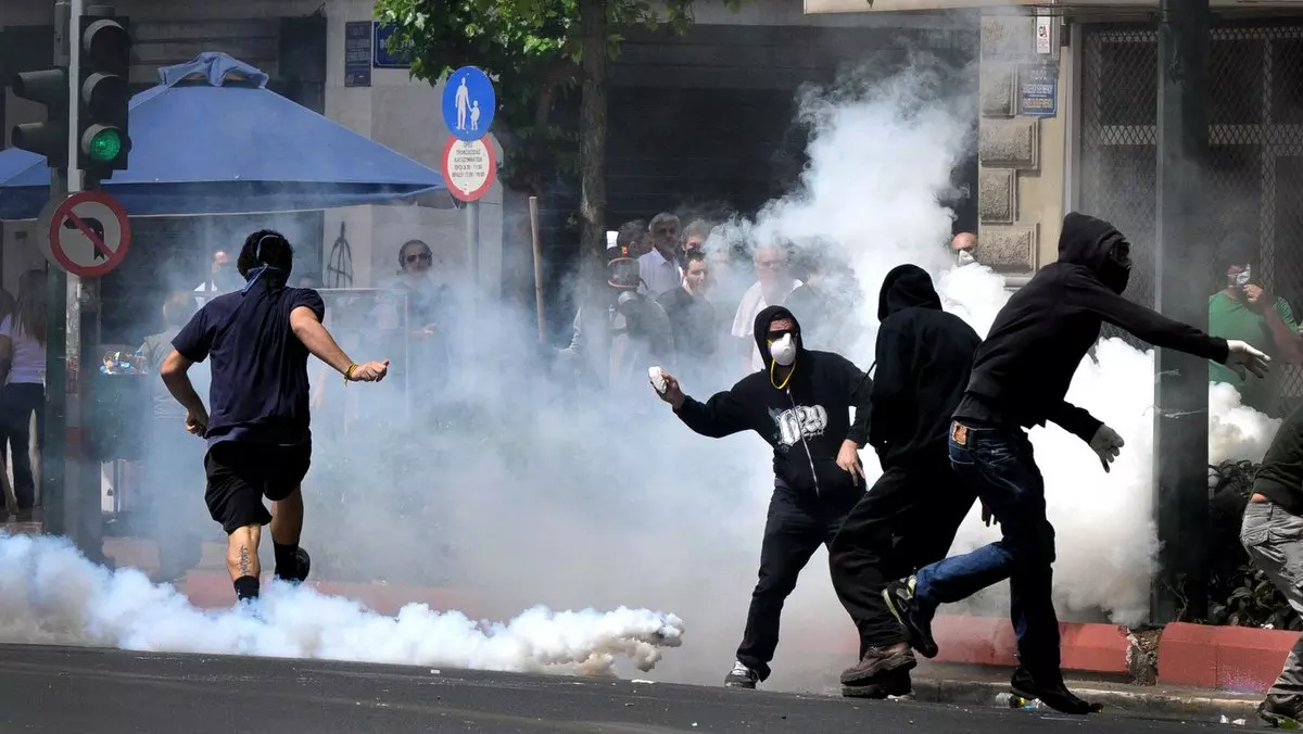 BROKEN ONE = BROKEN ALL::PROTESTERS WITH COVERED FACES © Koutsaftikis | iStockPhoto.com