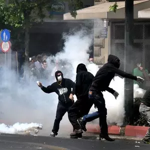 BROKEN ONE = BROKEN ALL::PROTESTERS WITH COVERED FACES © Koutsaftikis | iStockPhoto.com