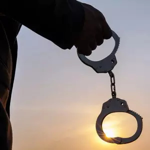 JESUS DELIVERED US FROM BONDAGE TO THE LAW::MAN HOLDING HANDCUFFS AFTER RELEASE © twinsterphoto | iStockPhoto.com JESUS DELIVERED US FROM BONDAGE TO THE LAW::MAN HOLDING HANDCUFFS AFTER RELEASE © twinsterphoto | iStockPhoto.com