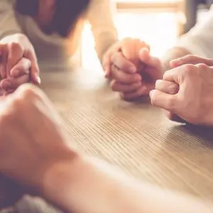 THE PHYSICAL LAW WAS GIVEN TO PHYSICAL ISRAEL::BUSINESS TEAM HOLDING HANDS AND PRAYING © vadimguzhva | iStockPhoto.com