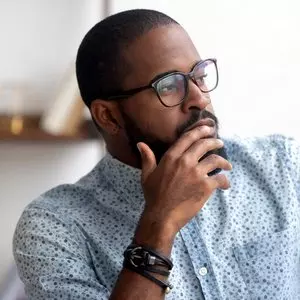 IS YESHUA REALLY G-D?::PENSIVE AFRICAN AMERICAN © fizkes | iStockPhoto.com