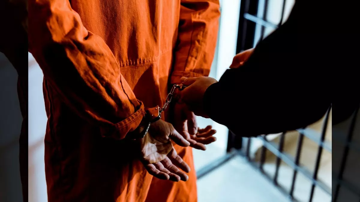 BEING UNDER THE LAW::PRISONER WEARING HANDCUFFS © LightFieldStudios | iStockPhoto.com