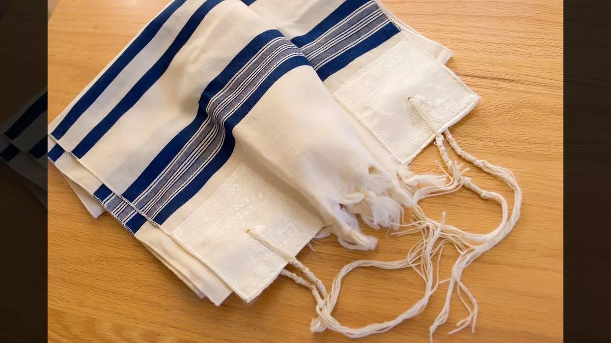 TZITZIT::TALLIT ON TABLE © erxolam | iStockPhoto.com