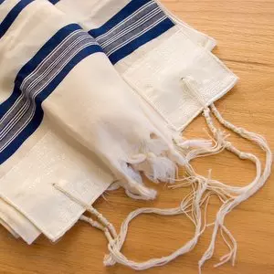 TZITZIT::TALLIT ON TABLE © erxolam | iStockPhoto.com