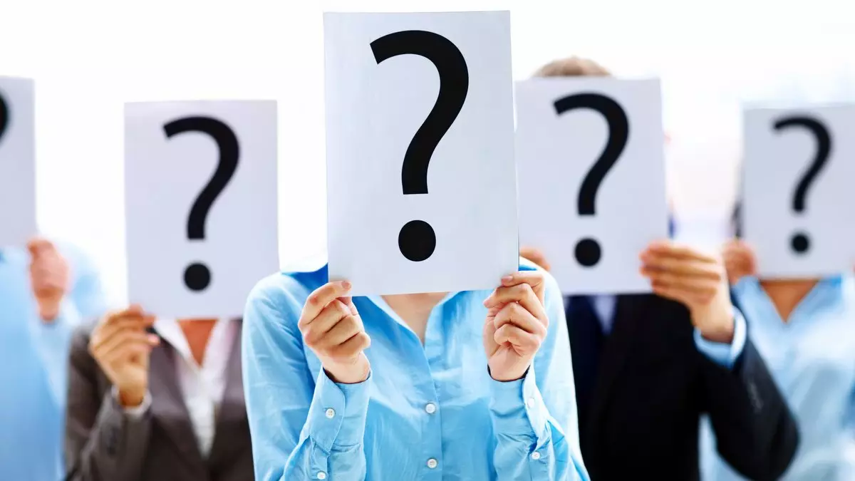 BUSINESS PEOPLE WITH QUESTION MARK © Yuri_arcurs | Dreamstime.com