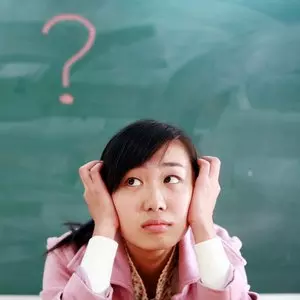 ASIAN GIRL WITH A RED QUESTION MARK © Zhudifeng | Dreamstime.com