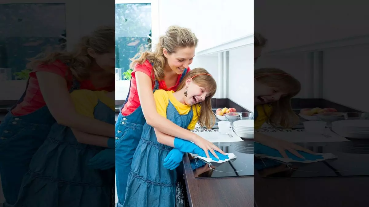 MOTHER AND DAUGHTER IN THE KITCHEN TOGETHER © Izabela Habur | iStockPhoto.com