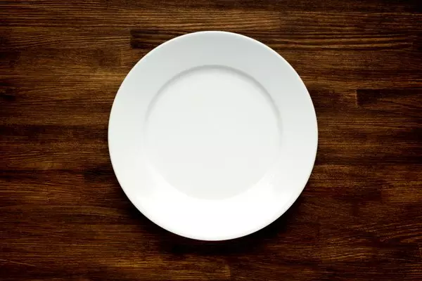 EMPTY WHITE PLATE ON WOODEN TABLE © Vladyslav Bashutskyy | Dreamstime.com