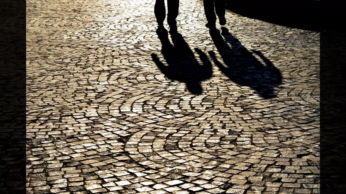 Parallels Between Joseph and Yeshua::SHADOWS ON PAVEMENT OF TWO MEN WALKING © Vlad Vahnovan | Shutterstock.com